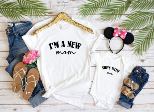 I’m A New Mom She’s With Me Shirt Funny Matching Bodysuit And Tee Our First Mother’s Day Gift For Mommy