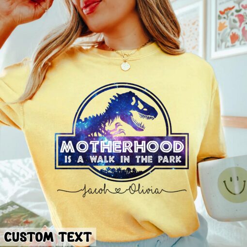 Motherhood Is A Walk In The Park Shirt With Custom Name’s Kid Funny Dinosaur Mother’s Day Gift For Mom Life