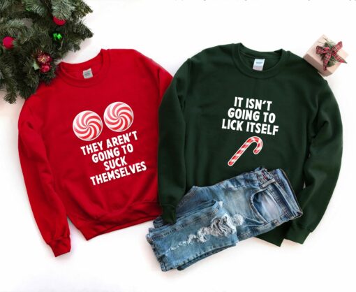 They Aren’t Going To Suck Themselves And It Isn’t Going To Lick Itself Couple Sweatshirt Christmas Vibes Lovely Unique Xmas Gift