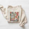 Santa Claus Reindeer Hot Cocoa Christmas Lights Holiday Movies Its Christmas Y’all Sweatshirt Cute Unique Xmas Gift