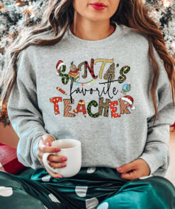 Santa’s Favorite Teacher Funny Christmas Sweatshirt Unique Xmas Gift