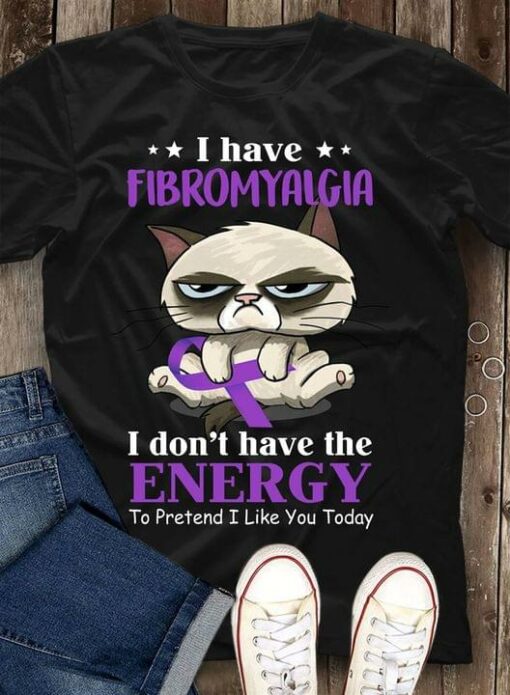 I Have Fibromyalgia I Don’t Have The Energy To Pretend I Like You Today Cartoon Cat Holding Purple Ribbon Shirt